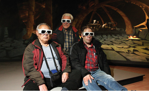 Inuit elders (left to
                           right) Louis Angalik, Mark Kalluak and Donald Uluadluak donned
                           stereoscopic glasses to take a tour through the virtual reality whalebone
                           hut created by U of C professors Peter Dawson and Richard Levy. Photo by
                           Ken Bendiktsen. 